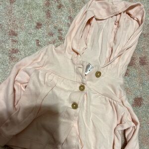 6 months. Carter’s brand. Light pink jacket. Used condition.